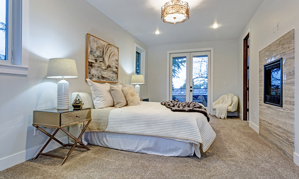 Blog - Does my homeowners insurance cover Airbnb or VRBO properties - Modern Guest Bedroom Cleaned Up With White Walls and Decor